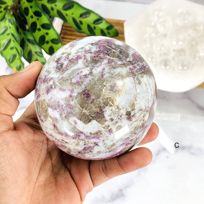 Close up of Option C - Lepidolite Sphere on hand