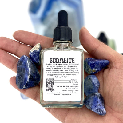 one sodalite gem essence bottle in hand for size reference