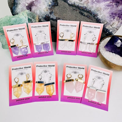 multiple earring pairs displayed to show the differences in the crystals and their colors 