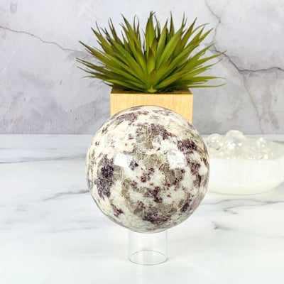 Frontside of the Lepidolite Sphere on acrylic stand