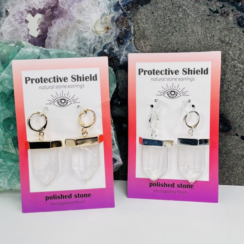 close up of the protective shield earrings in crystal quartz electroplated in gold or silver