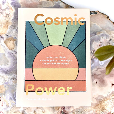 Cosmic Power book on a table