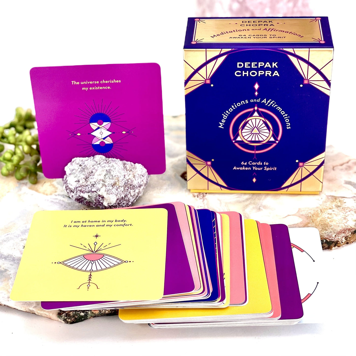 Meditations and Affirmation Card Deck spread out with decorations in the background