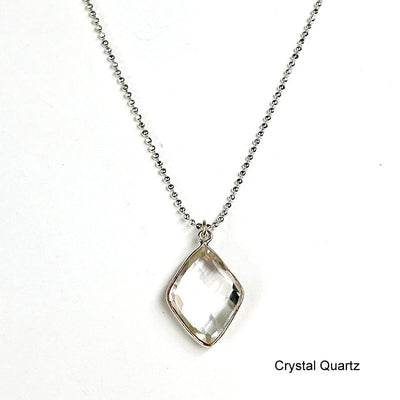 close up of the details on the crystal quartz faceted diamond pendant 