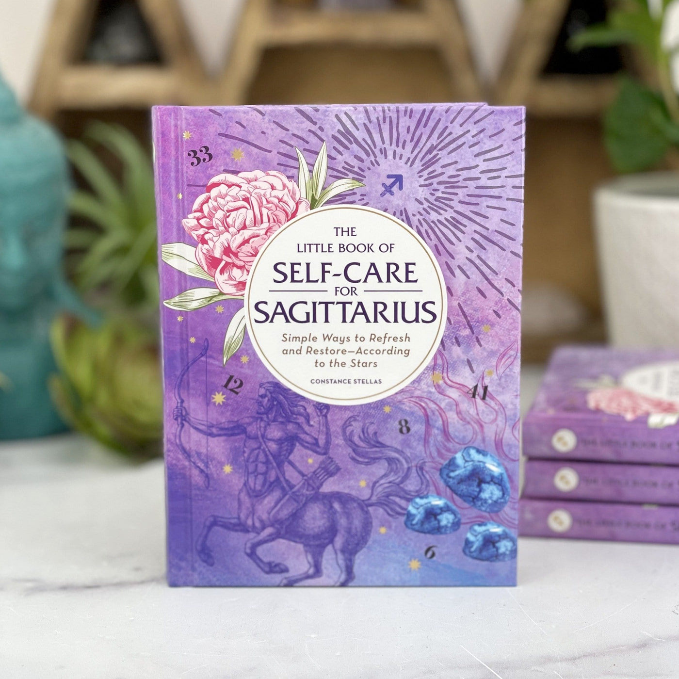 The Little Book of Self-Care for Sagittarius in purple 