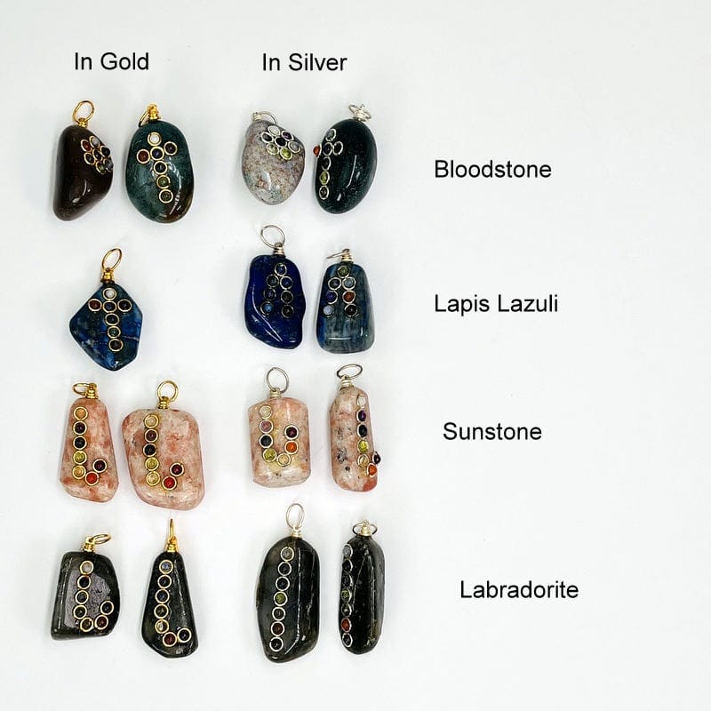 tumbled stones with a chakra accent displayed to show the available stones. all come with either a silver or gold bail. available in bloodstone, lapis lazuli, sunstone or labradorite 