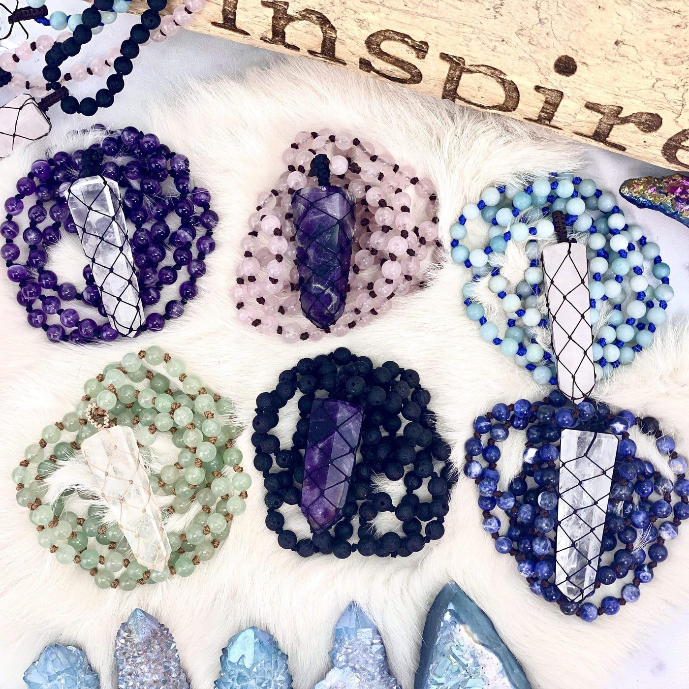gemstone point pendants all curled up
