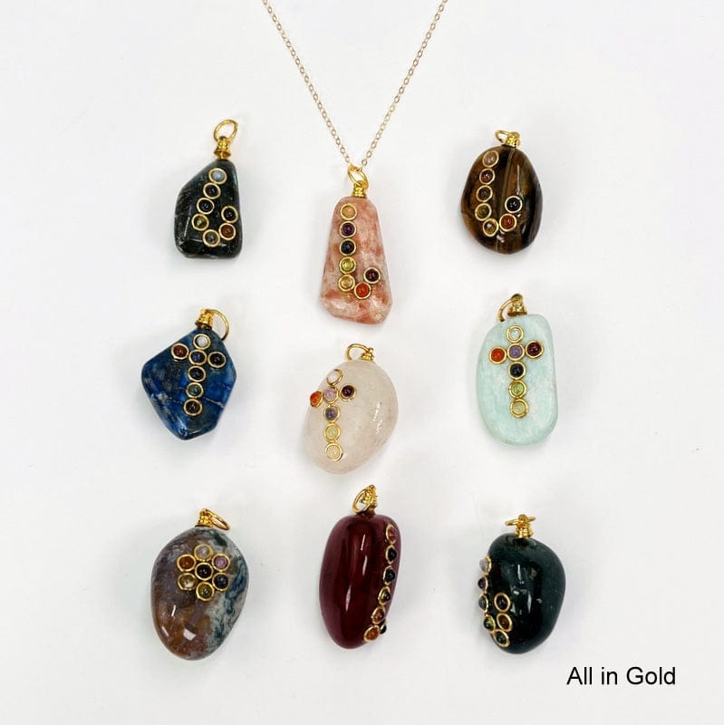 all of the tumbled stone pendants with a chakra accent and a gold toned bail