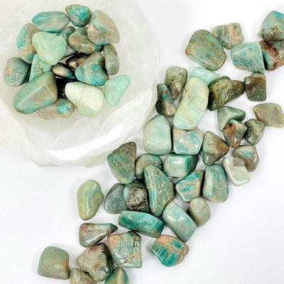 amazonite small tumbled stones displaying the different size variations and color patterns 