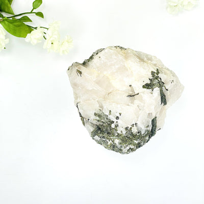 A vibrant Epidote in Quartz with white background