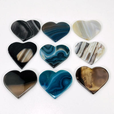 black and blue agate hearts on a table