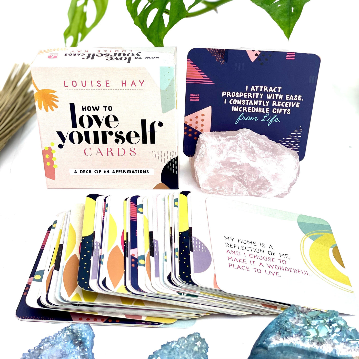 Photo showing the outer box of How to love yourself cards, and some of the cards spread out.