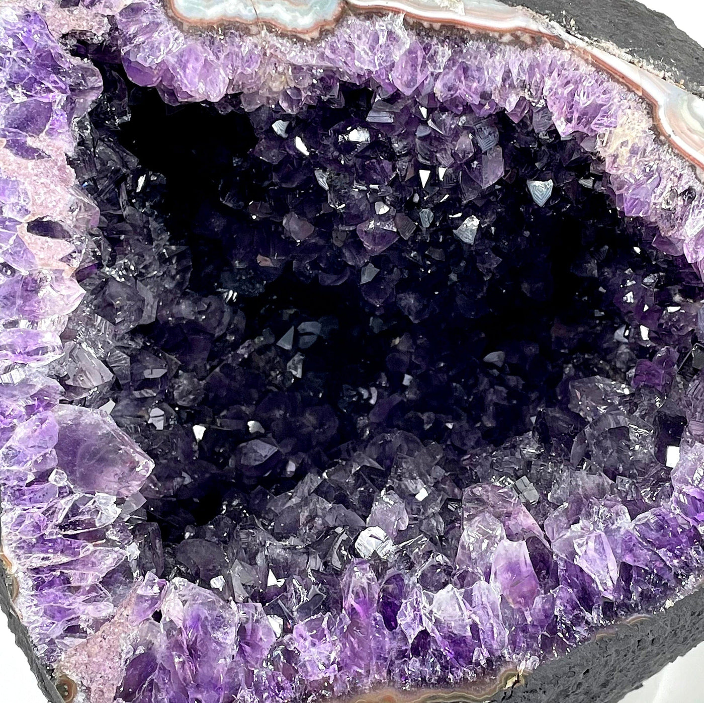 close up of the front of amethyst round cave geode for details