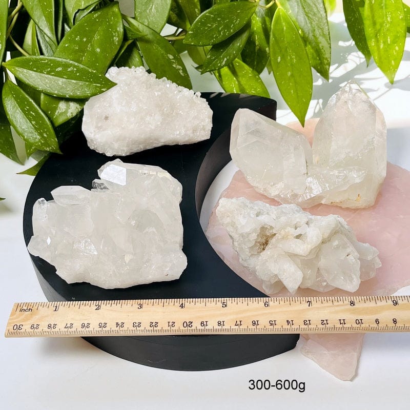 crystal clusters displayed next to a ruler for size reference. available in 300-600g