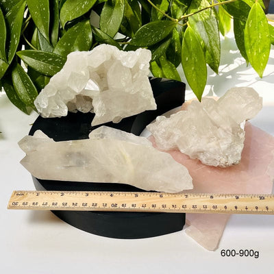 crystal clusters next to a ruler for size reference. showing the 600-900g clusters 