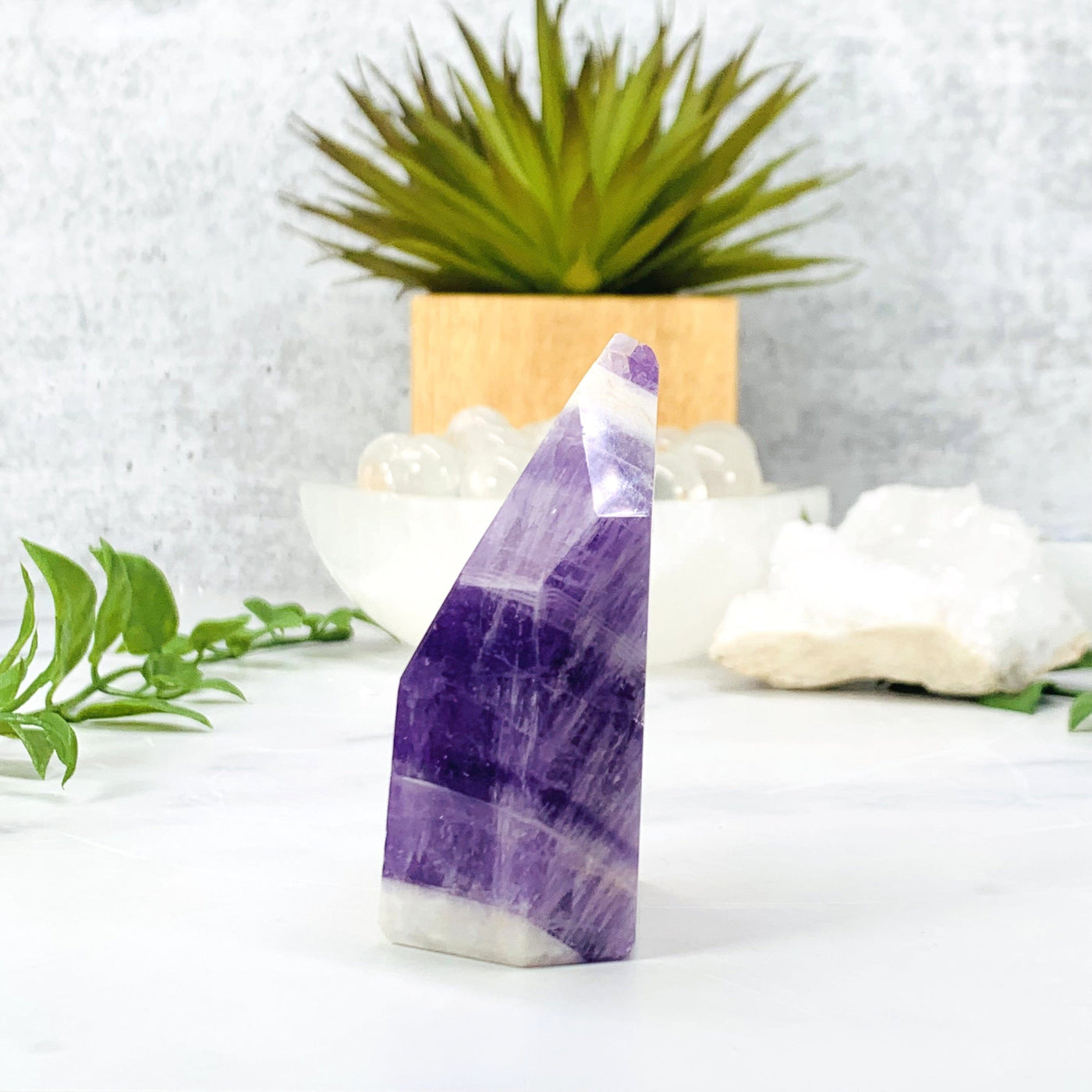 Side angle of the  Chevron Amethyst Polished Point