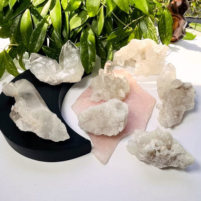 multiple crystal quartz clusters displayed to show the differences in the sizes 