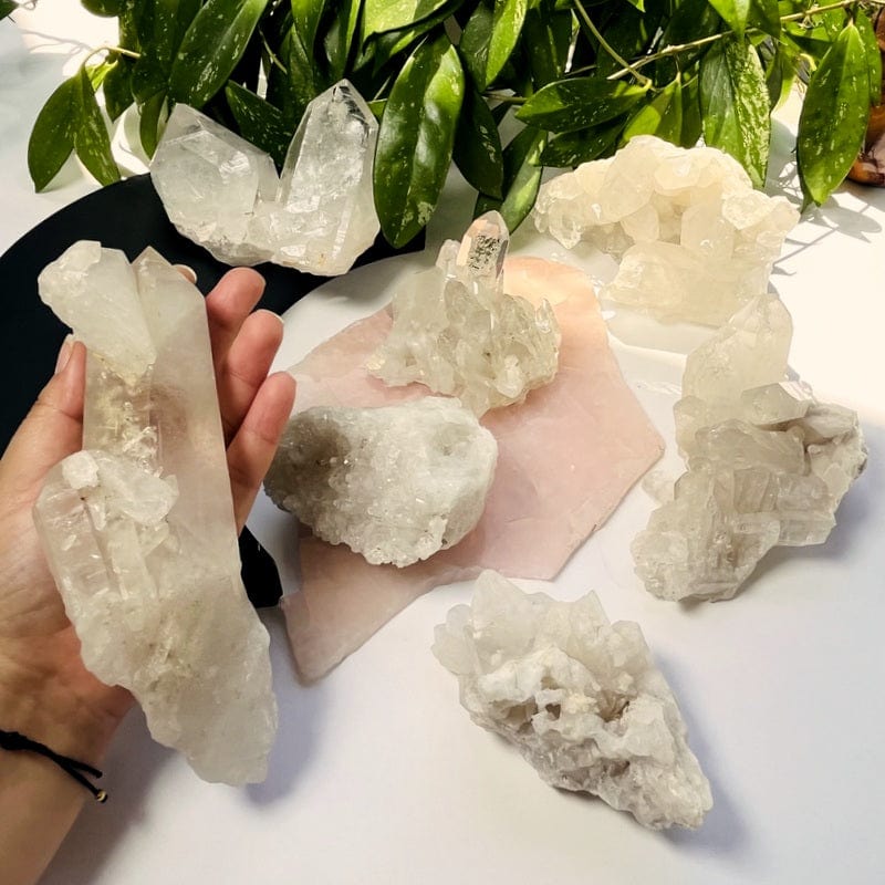 crystal quartz clusters in hand for size reference 