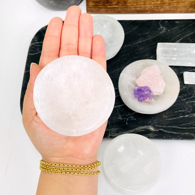 selenite bowl in hand showing small size 