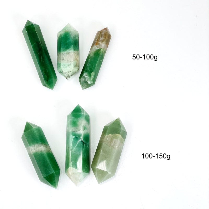 green and white quartz double terminated points next to weight in grams 
