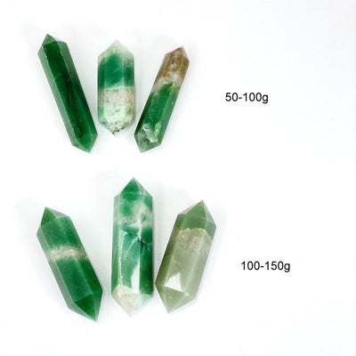 green and white quartz double terminated points next to weight in grams 