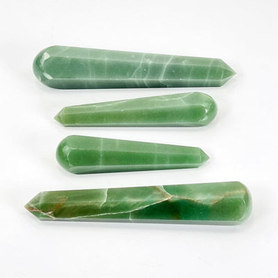 green quartz polished massage points on white background 