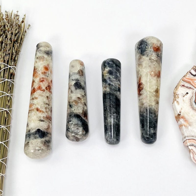 multiple iolite and sunstone massage wands displaying the different pattern combinations 