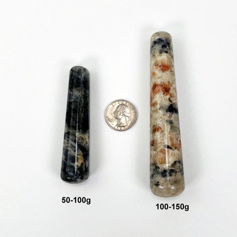 iolite and sunstone massage wand next to a quarter and its size in grams for size reference 