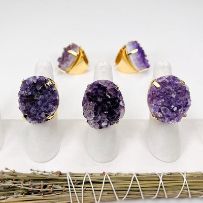 amethyst cluster ring displayed to show the differences in the shades of purple 