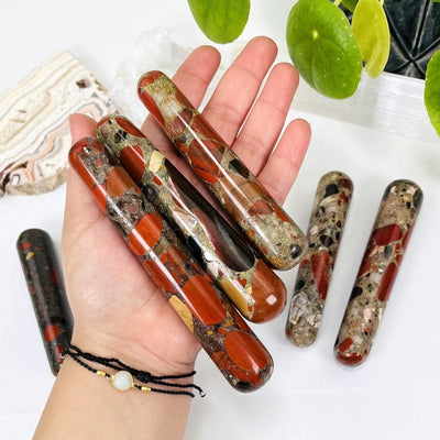 multiple jasper massage wands in hand for size reference 