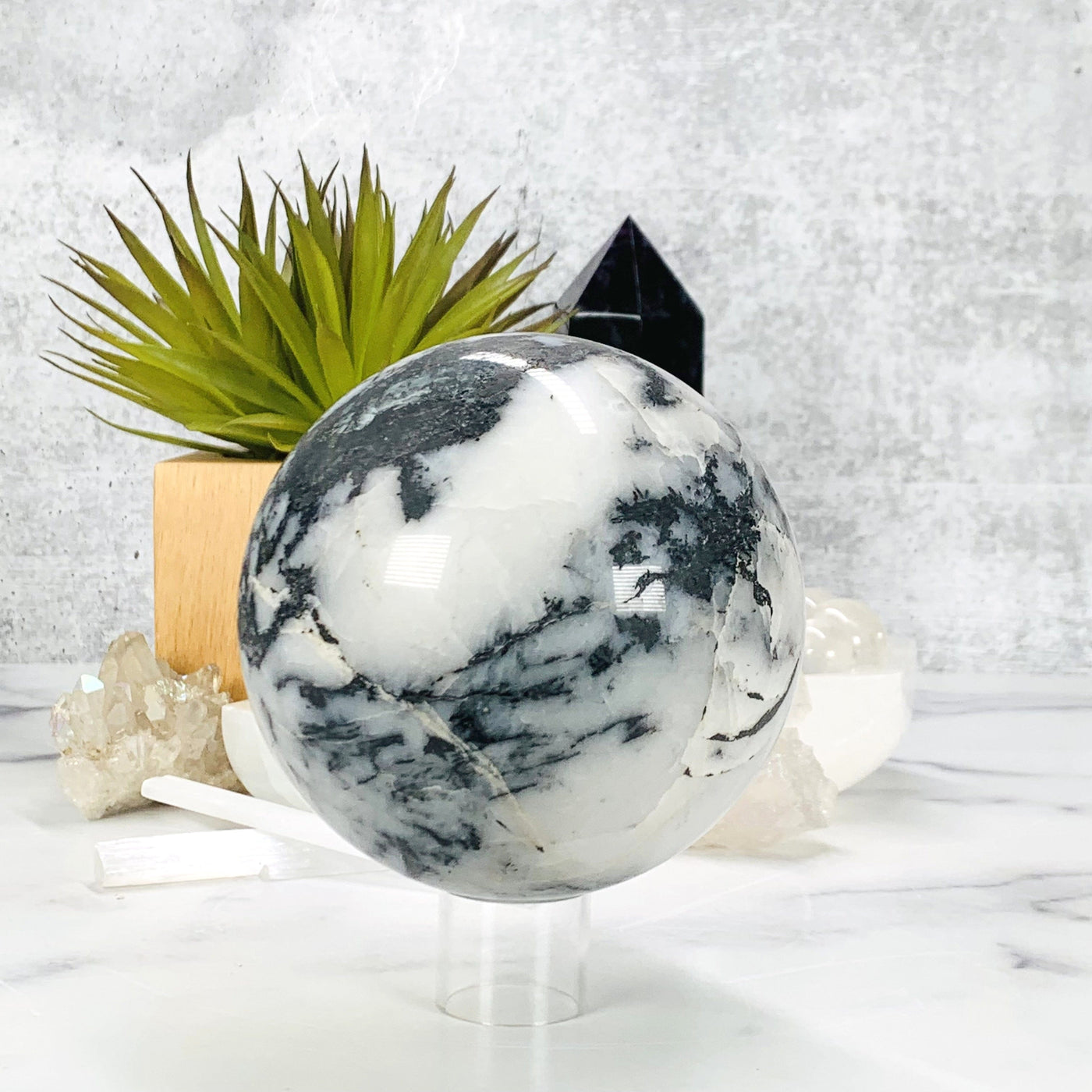 Frontside of the Zebra Jasper Polished Sphere on acrylic stand