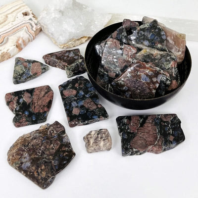 rhyolite semi-tumbled stone slabs in bowl and on counter top used as home decor