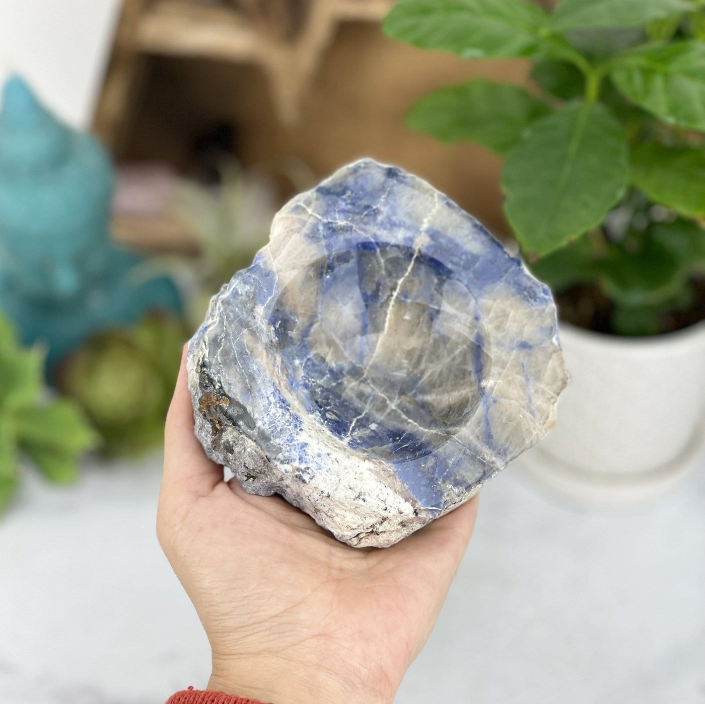 sodalite polished soap dish in hand for size reference