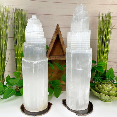 two selenite xxl lamps on display in front of backdrop for possible variations