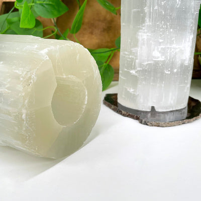 one selenite xxl lamp laying on its side with the bottom facing forward to see the drilled hole for your light and cable
