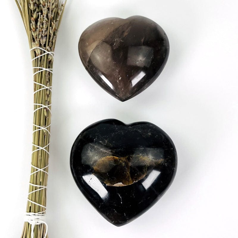 close up of two smokey quartz puff hearts