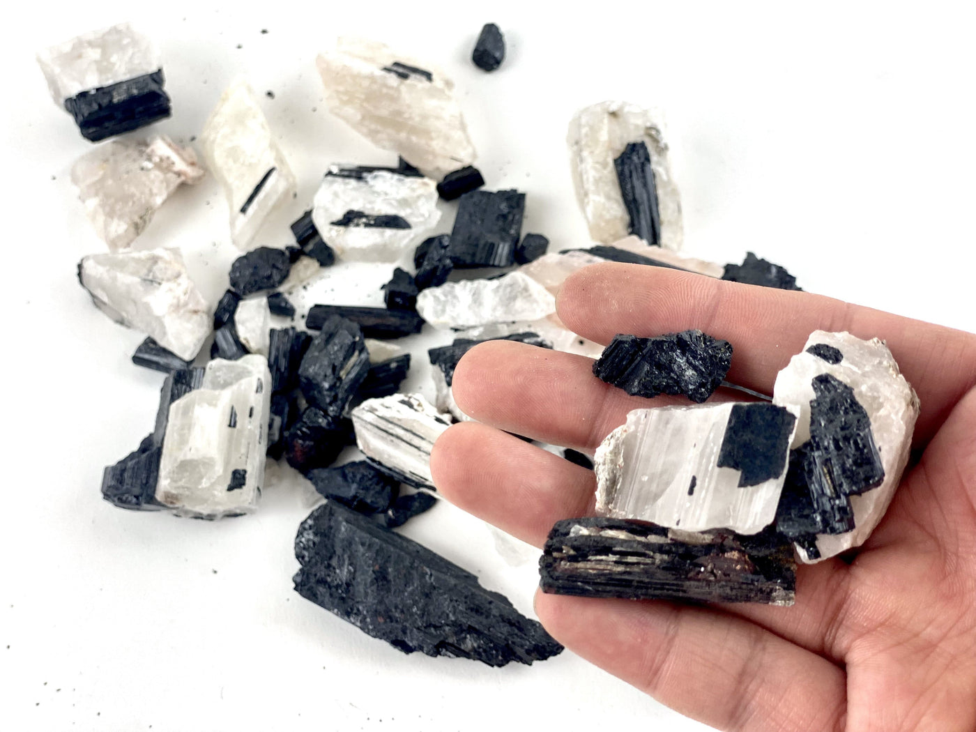 1/2 Lb Black Tourmaline on Matrix Chunks in hand for size comparison 