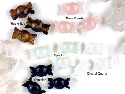 Gemstone Candy spread out showing names of stone, next to the stones available. Tigers eye, rose quartz, opalite, crystal quartz, obsidian
