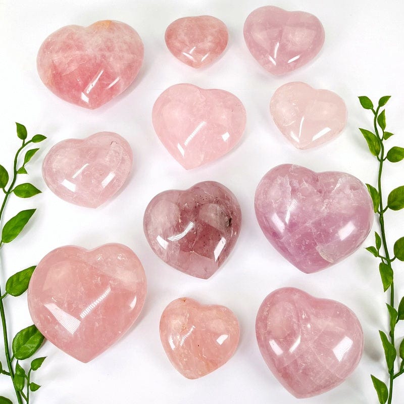 multiple rose quartz puff hearts on white background showing the different sizes available 