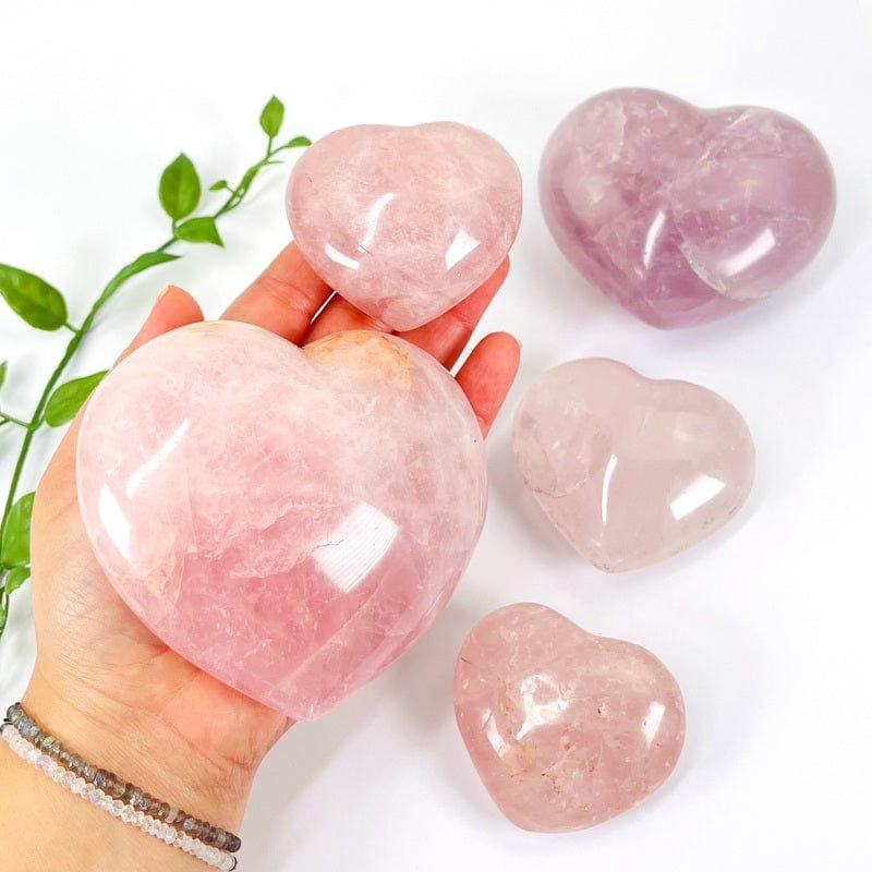 rose quartz puff hearts in hand for size reference 