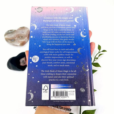 close up of the back of the book titled the little book of moon magic by sarah bartlett