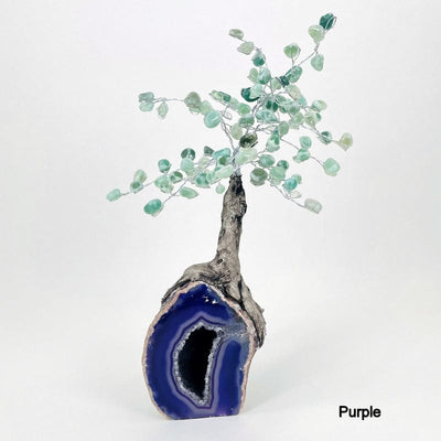 purple geode base tree with green quartz tumbled stones on the top portion