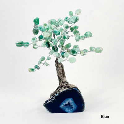 blue geode base tree with green quartz tumbled stones on the top portion