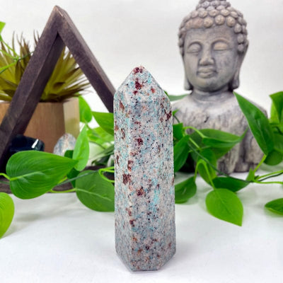 amazonite polished point in front of backdrop