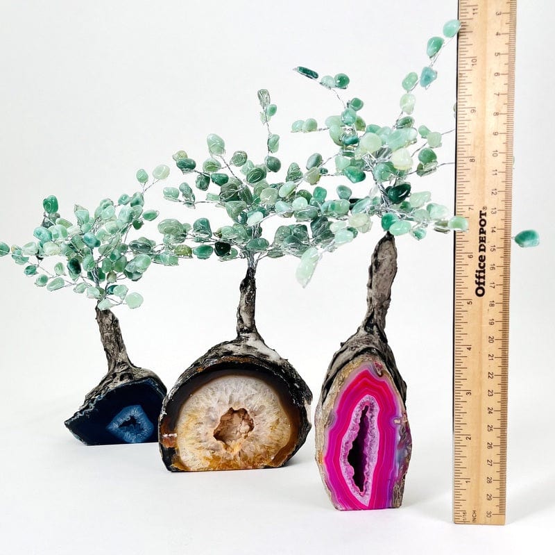 multiple geode trees next to a ruler for size reference 