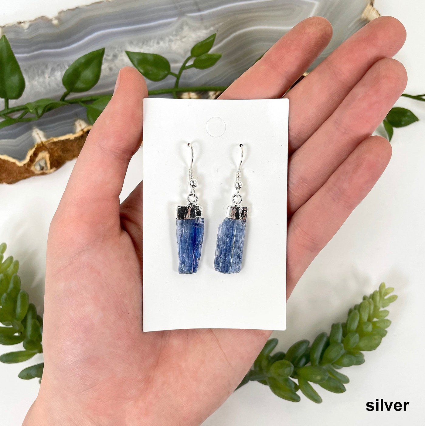 silver blue kyanite earrings in hand for size and finish reference