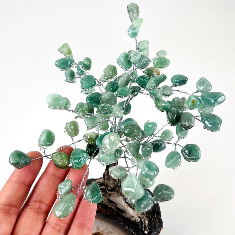 close up of the green quartz tumbled stones that make up the top part of the tree