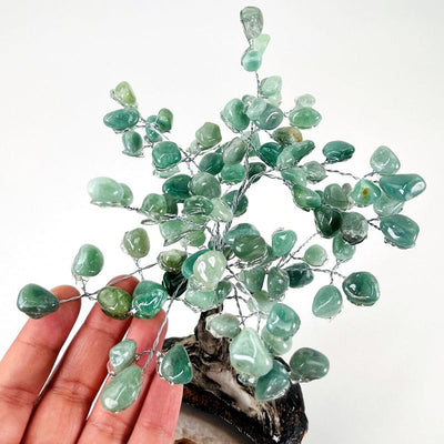 close up of the green quartz tumbled stones that make up the top part of the tree