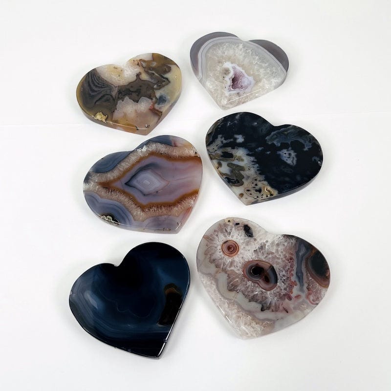 multiple natural agate hearts displayed on white background showing the different types of variations