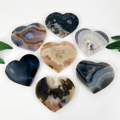 multiple natural agate hearts displayed on white background showing the different types of variations 